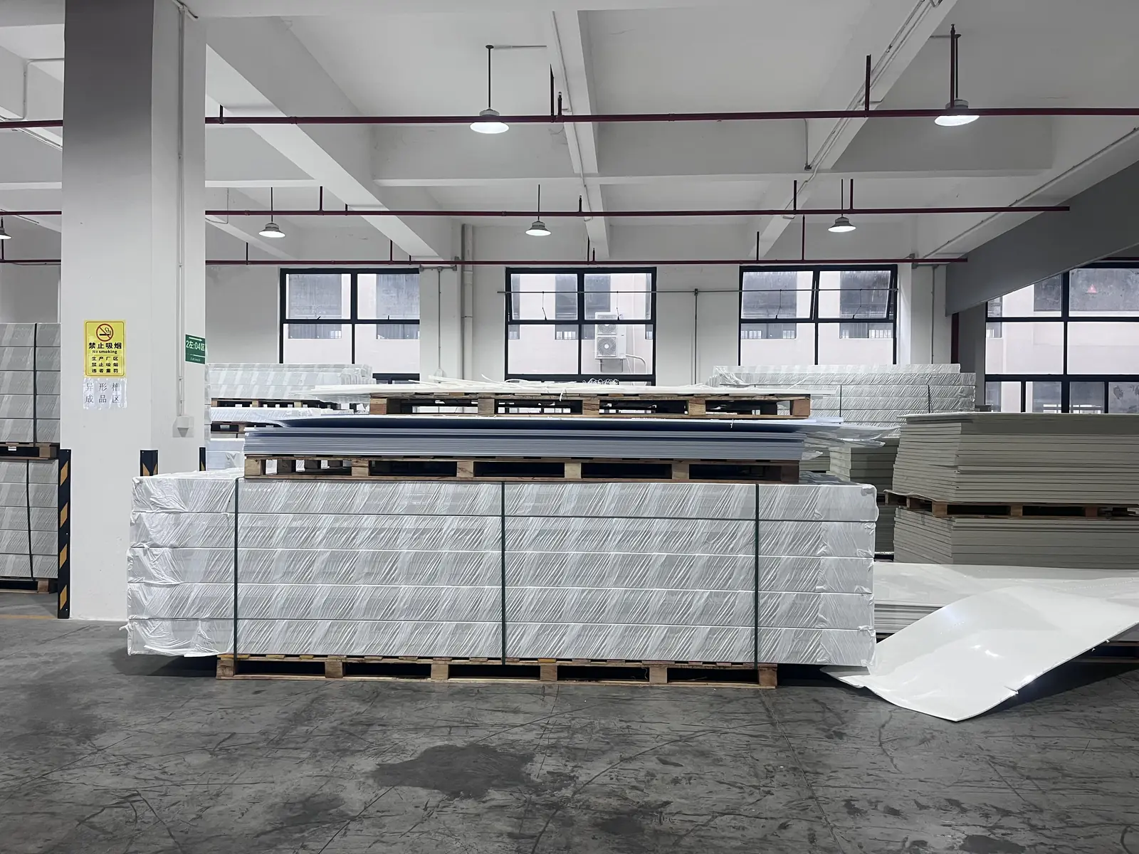 Wrapped PP sheets stored on pallets at QEEHUA