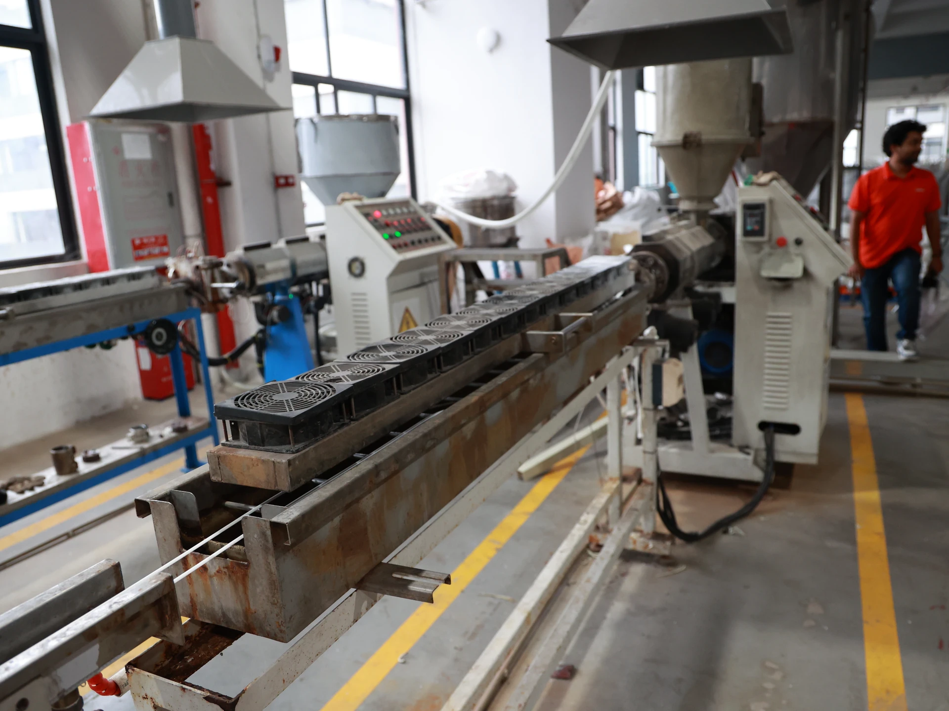Close view of QEEHUA welding rod production equipment